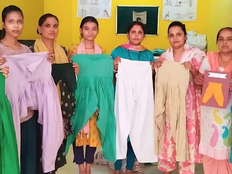 Women creating sustainable boutique clothing from recycled fabrics